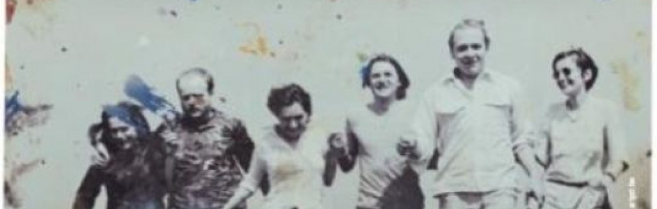Seven running people holding hands