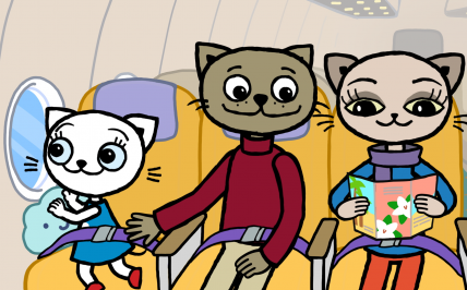 trzy koty podróżujące w samolocie